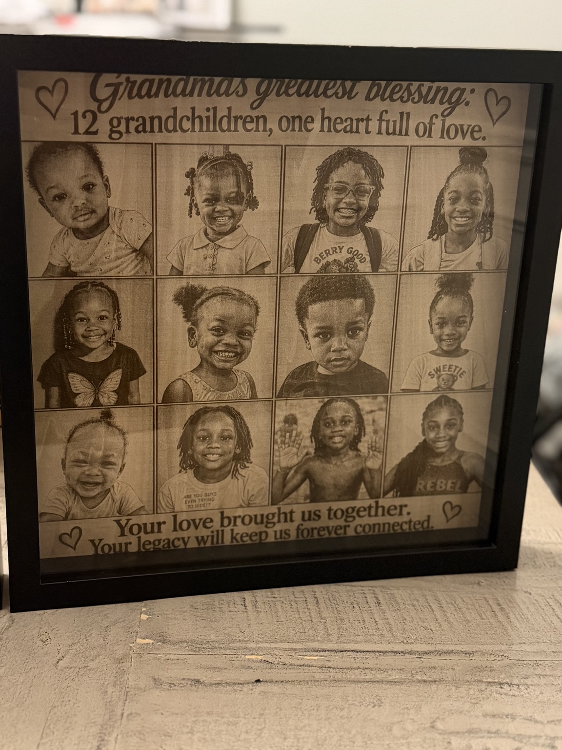 Framed custom engraved photo collage featuring twelve grandchildren